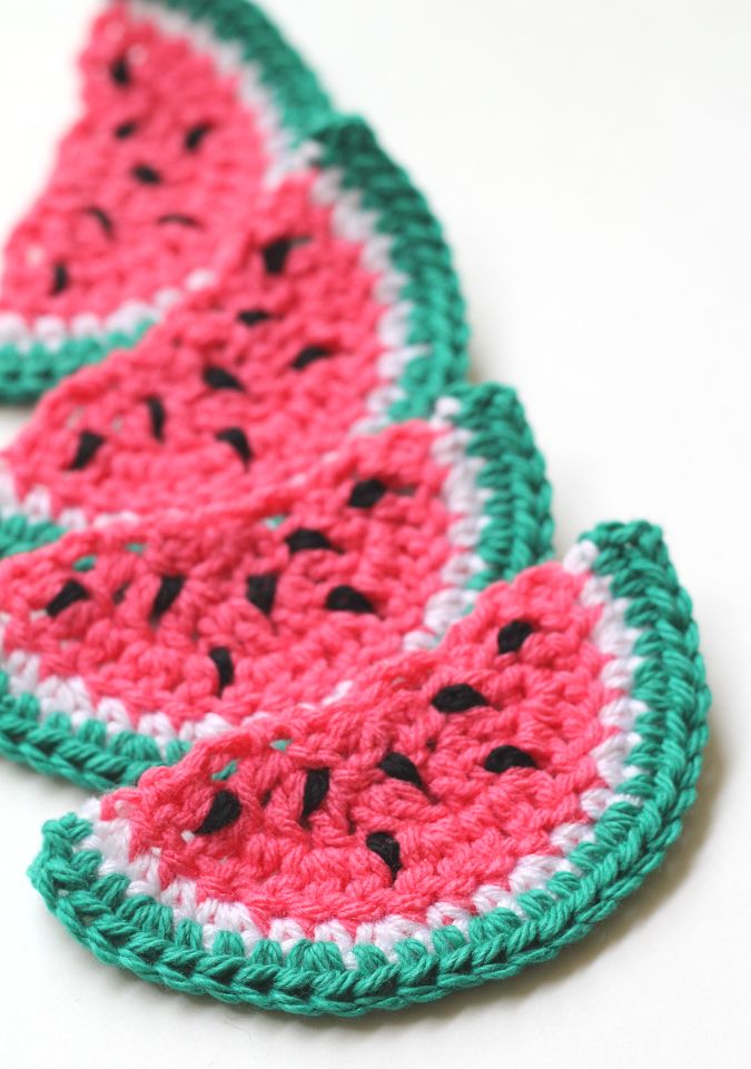 crocheted watermelon coasters on white surface