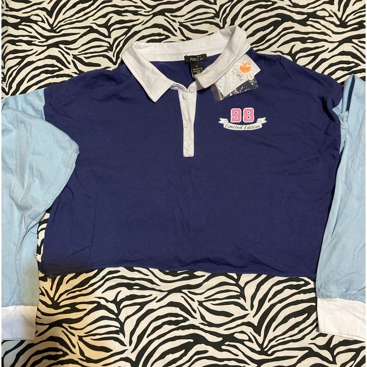 Nwt Juniors Rue 21 Cropped Babe 98 Long Sleeve Button Up Shirt Size S 100% Cotton Collared Tops For Summer College Season, Collared Tops For College In Summer, Collared College Style Tops, Collared Tops For College In Spring, Trendy Navy Tops For Streetwear, Long Sleeve Summer Shirt For College, Casual Collared Tops For College, Blue Collared Tops For College, Blue Fitted Tops For College