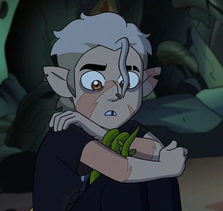 an animated character with white hair and blue eyes, holding his arms crossed in front of him