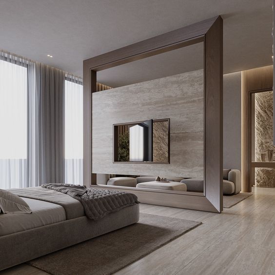 a bedroom with a large bed and mirror on the wall