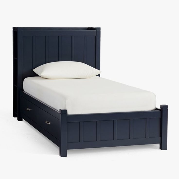 a bed with two drawers underneath it and a white pillow on the top of it