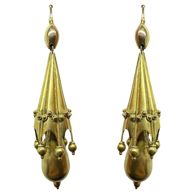 Add a touch of vintage elegance with these stunning 14k Victorian Drop Earrings. Crafted in 14k yellow gold and featuring a 2.25 inch length, these earrings have a delicate and feminine look. In good condition with minor wear, they make a perfect addition to any jewelry collection. 14k Victorian Drop Earrings Condition: In good condition with some minor surface wear consistent with age. Period: Victorian Length: 2.25 inches Markings: Metal: 14k Yellow Gold Weight: 5.9 grams Victorian Drop Earrings, Vintage Elegance, Feminine Look, Metallica, Jewelry Collection, Period, Jewelry Earrings, Yellow Gold, Drop Earrings