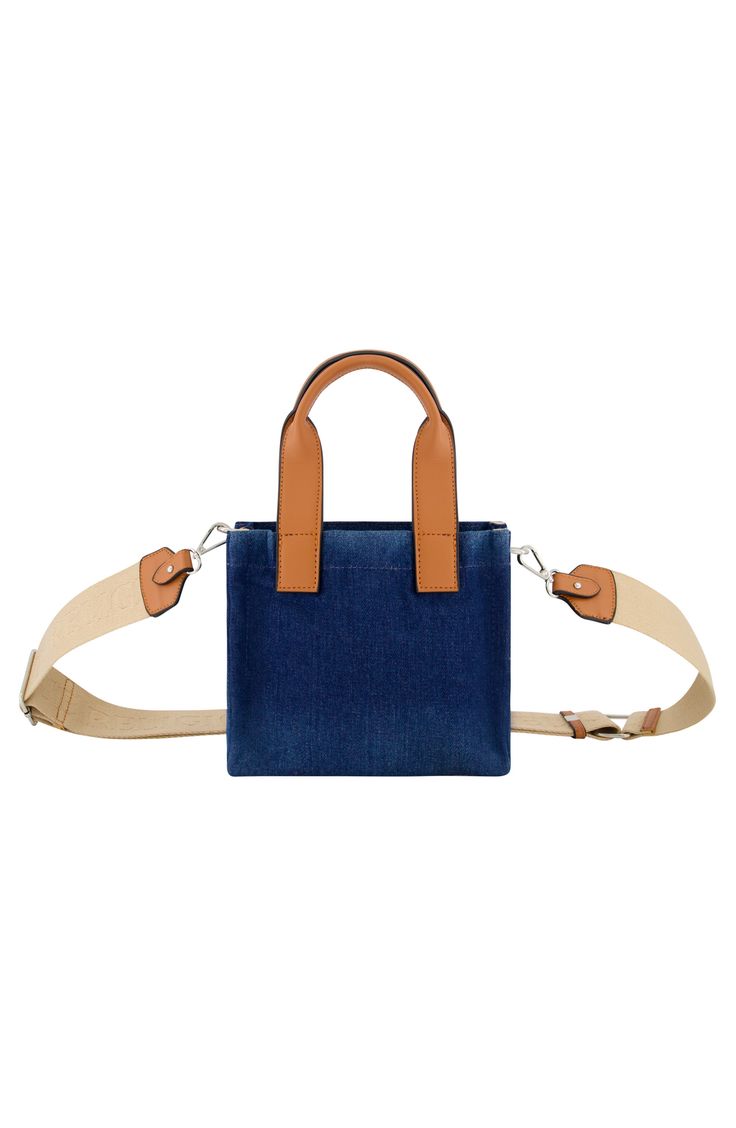 Show off signature style with this mini denim tote bag featuring a removable crossbody strap for instant versatility. 8" x 7" x 4" 5" handle drop; 29" strap length Magnetic snap closure Dual shoulder straps; removable, adjustable crossbody strap Exterior slip pocket Textile lining Textile Imported Spring Denim Blue Shoulder Bag With Adjustable Strap, Rectangular Denim Bag, Rectangular Denim Blue Shoulder Bag For Spring, Rectangular Denim Bag For Everyday Use, Daily Use Denim Bags With Top Carry Handle, Denim Blue Rectangular Shoulder Bag For Spring, Casual Denim Bag With Top Carry Handle, Denim Rectangular Satchel For Everyday Use, Rectangular Denim Satchel For Daily Use