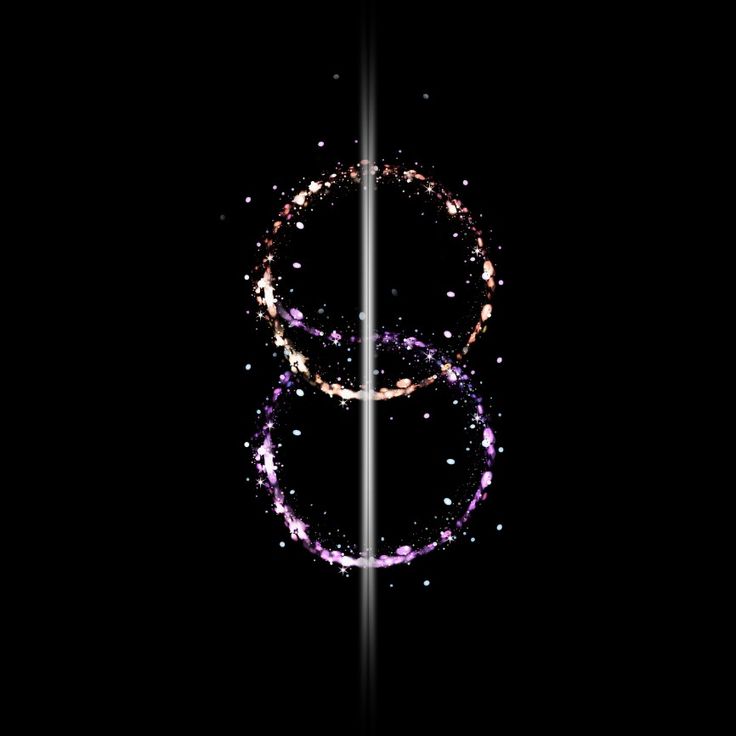 two rings are shown in the dark with sparkles