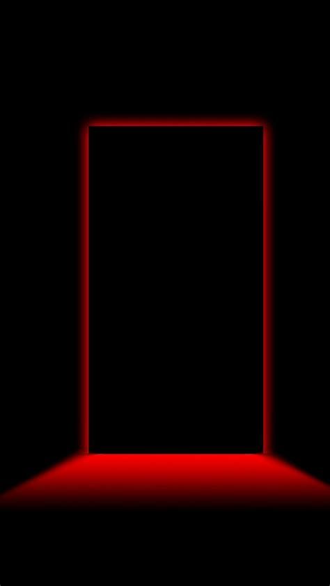 an open door in the dark with red light coming from it's opening hole