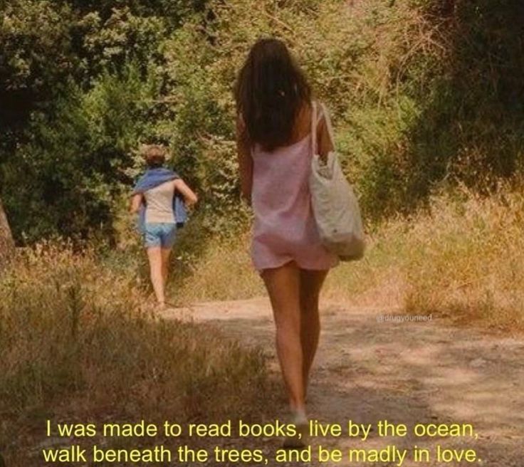 two girls walking down a dirt road with trees in the background and a quote about reading books