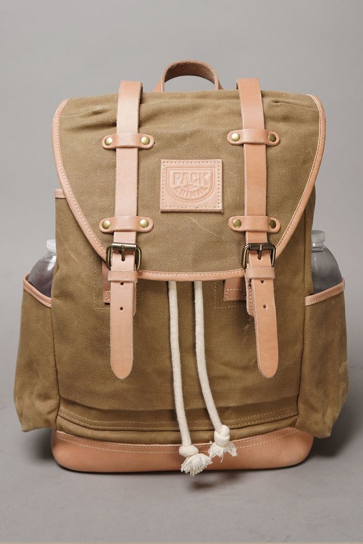 After a successful Kickstarter debut, this pack is now available for order. Classic and beautifully simple, the Extra Mile Backpack is a heritage quality everyday bag, with a touch of contemporary design. After thousands of miles of riding, countless commutes, and more trips than we can remember—we are proud to offer a pack you can count on for years of service. It's in the details: This heavy duty, waxed canvas pack features a drawstring opening and cover flap to keep everything you need inside Rugged Standard Backpack With Adjustable Strap, Rugged Canvas Backpack For Everyday, Rugged Canvas Backpack, Rugged Backpack With Leather Handles For Everyday, Rugged Backpack With Leather Handles, Rugged Everyday Backpack, Functional Leather Backpack With Canvas Lining, Everyday Rugged Standard Backpack, Waxed Canvas Satchel Backpack