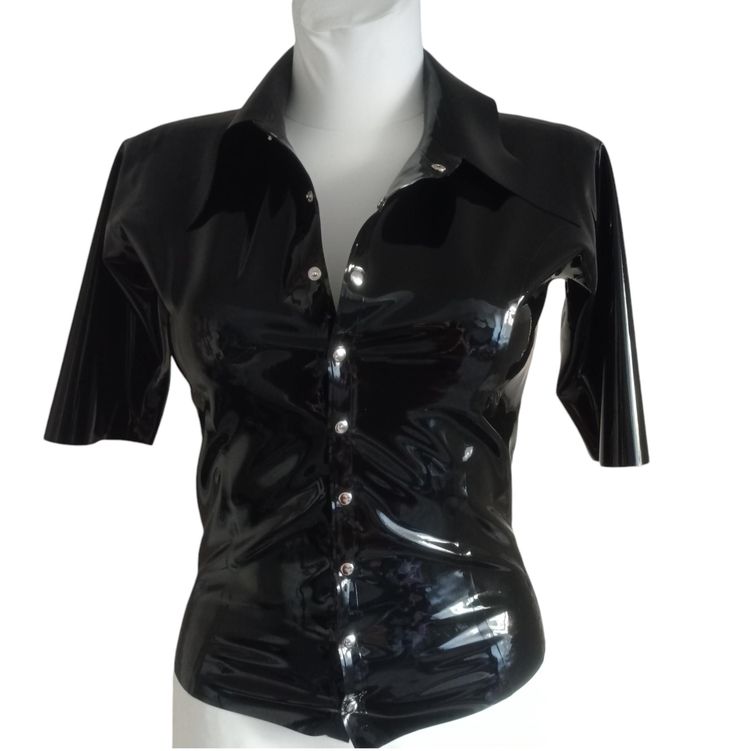 Latex blouse with a collar, fastened with snaps at the front. This item is made to order. After placing the order, please provide the dimensions in the comments: bust, waist, hips and arm circumference. If you have any questions, please contact us. - Made in Poland - Latex made in Poland - Handmade product. LATEX CARE: - Be careful with sharp objects, including jewelry or fingernails. - Do not use oil-based lubricants, including body moisturizers. - After use, wash in mild soapy water and then rinse with fresh water. Hang up and leave to dry in a dry place. - When dressing, talcum the product well or use silicone-based lubricants. - Store at room temperature and do not expose to sunlight or UV lamps. The company does not accept returns of custom-made products. If for some reason the item d Stretch Short Sleeve Blouse With Buttons, Short Sleeve Stretch Blouse With Buttons, Stretch Button-up Shirt, Classic Stretch Blouse With Button Closure, Fitted Collared Top For Party, Fitted Collared Party Top, Fitted Blouse With Button Closure, Stretch Short Sleeve Blouse With Button Closure, Collared Stretch Top With Button Closure