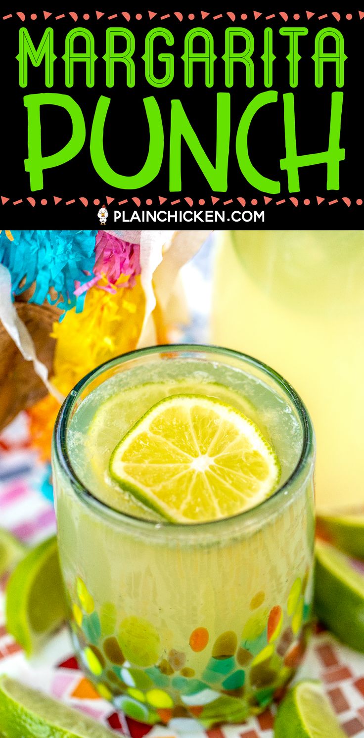 margarita punch in a glass with lime slices on the rim