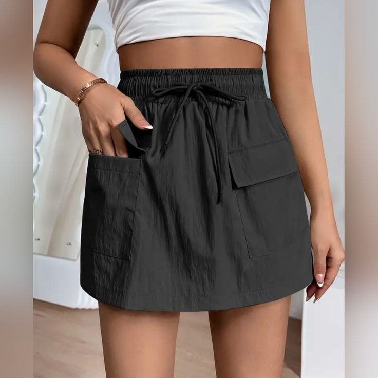 New - Never Worn Elastic Waste Runs One Size Big (Roughly 12) Casual Summer Skort With Pockets, Summer Black Shorts With Pockets, Black Spring Skort With Pockets, Spring Black Skort With Pockets, Spring Vacation Skort With Pockets, Casual Black Short Length Skort, Casual Black Short-length Skort, Casual Skort With Drawstring, Casual Solid Skort With Pockets