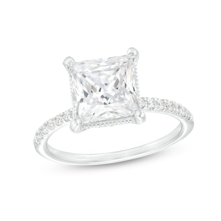 a princess cut diamond engagement ring with pave set diamonds on the shoulders and sides