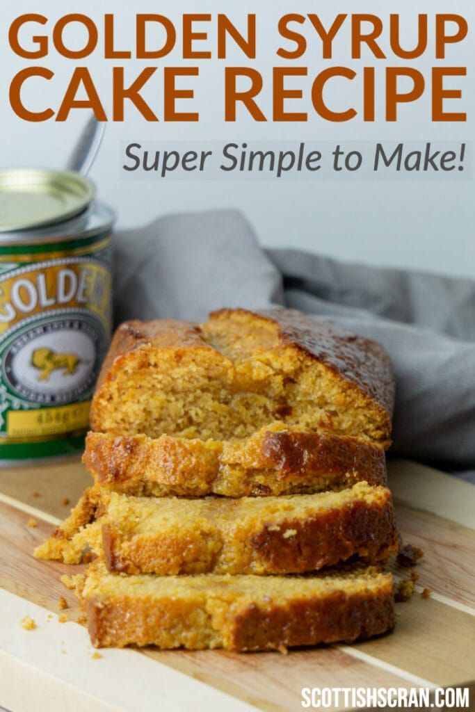 sliced loaf of golden syrup cake on a cutting board with a can of butter in the background