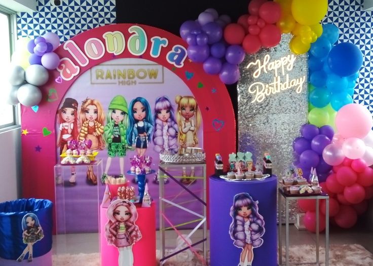 there is a birthday party with balloons and decorations on the wall, along with barbie dolls