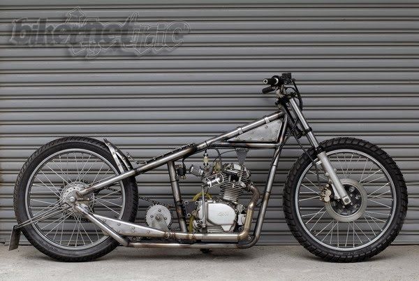 a motorcycle parked in front of a garage door