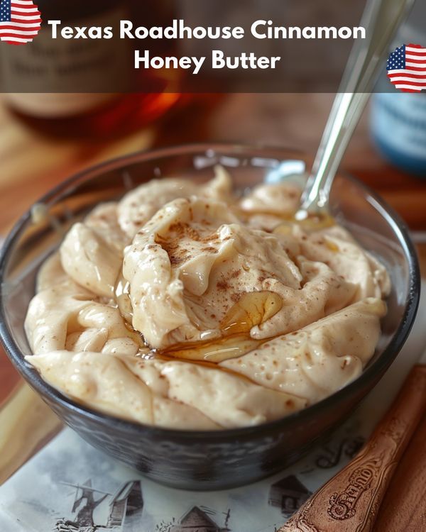 a bowl filled with honey butter on top of a wooden table next to an american flag