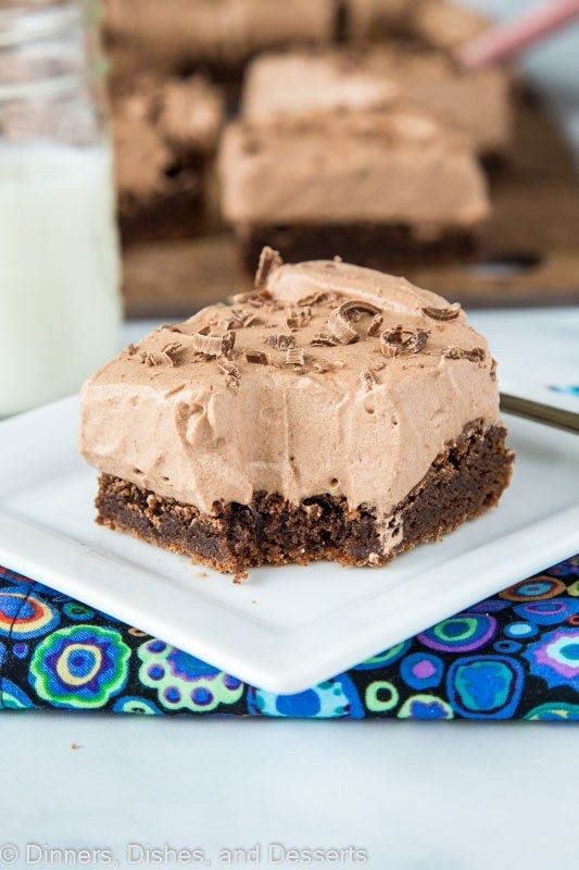 chocolate mousse brownies on a white plate with the words moonies above it