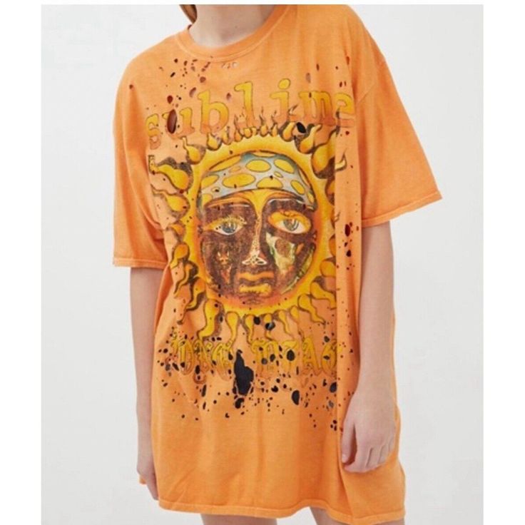 This Urban Outfitters X Sublime Distressed Holes Oversized Women Tee Tshirt In Size S/M Is Perfect For Casual Occasions. The Crew Neck And Short Sleeves Provide Comfort, While The Pullover Closure Makes It Easy To Wear. The Orange/Multicolor Cotton Material Is Machine Washable And Breathable, Making It Suitable For All Seasons. The Relaxed Fit And Casual Sleeve Type Add To The Comfortable And Laid-Back Style Of The T-Shirt. The Heavy Metal, Rock, Punk, Vintage, Music, Ska, Steampunk, Retro, And Cotton Tshirts For Women, Oversized Band Tshirt Dress, Hippie Inspired Shirts, Vintage Hippie Shirts, Cheap Oversized Graphic Tee, Cheap Retro T-shirt By Urban Outfitters, All Over Print Tshirt Women, Affordable Retro T-shirt By Urban Outfitters, Affordable Retro T-shirt From Urban Outfitters