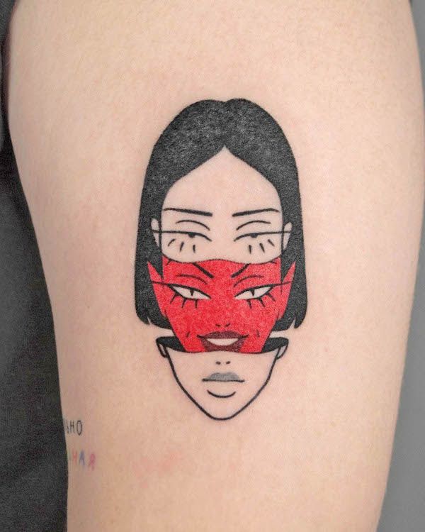 a woman's face has been drawn onto the side of her thigh and is wearing a red mask