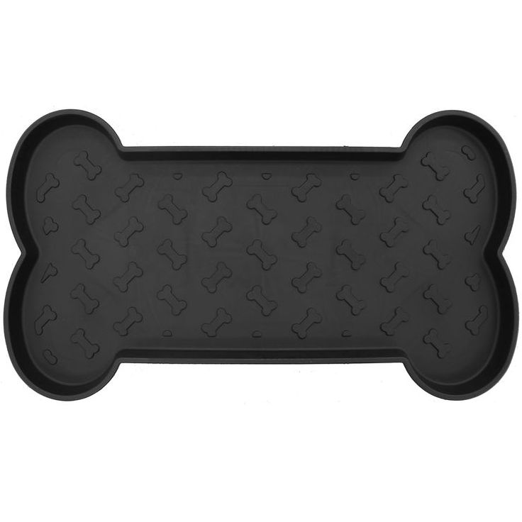 a black dog bone shaped cookie pan on a white background