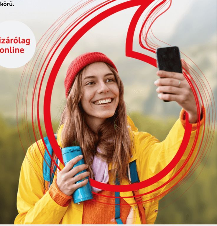 a woman taking a selfie with her cell phone while wearing a yellow jacket and red hat