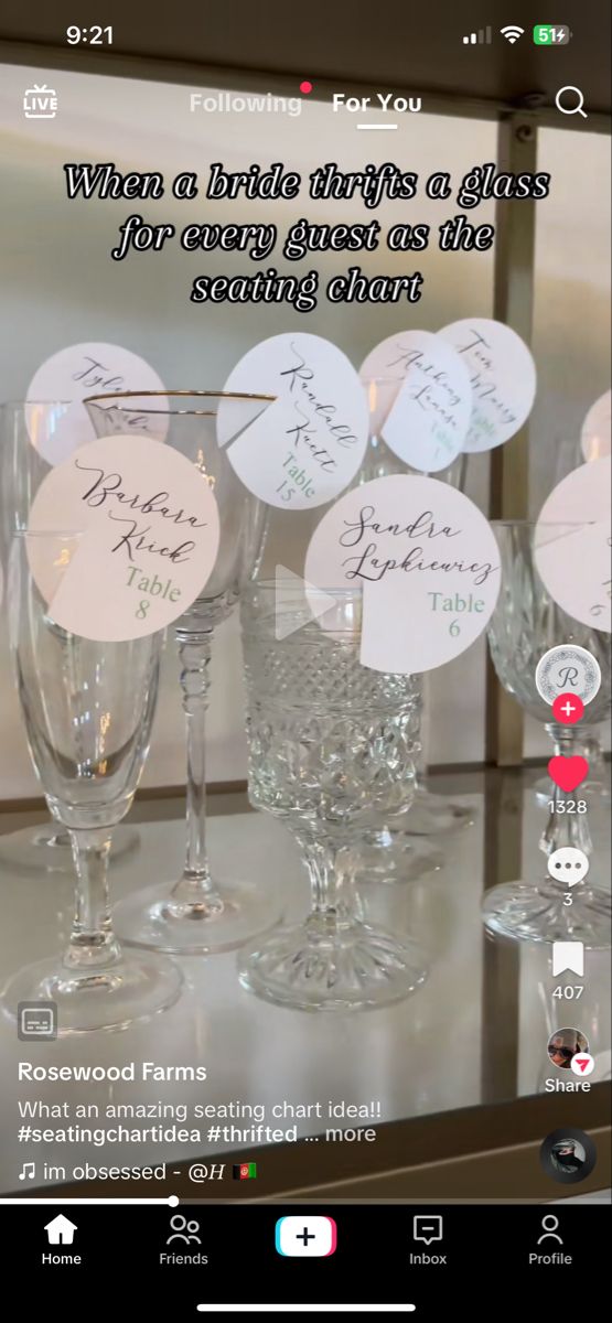 several wine glasses sitting on top of a table next to each other with names written on them