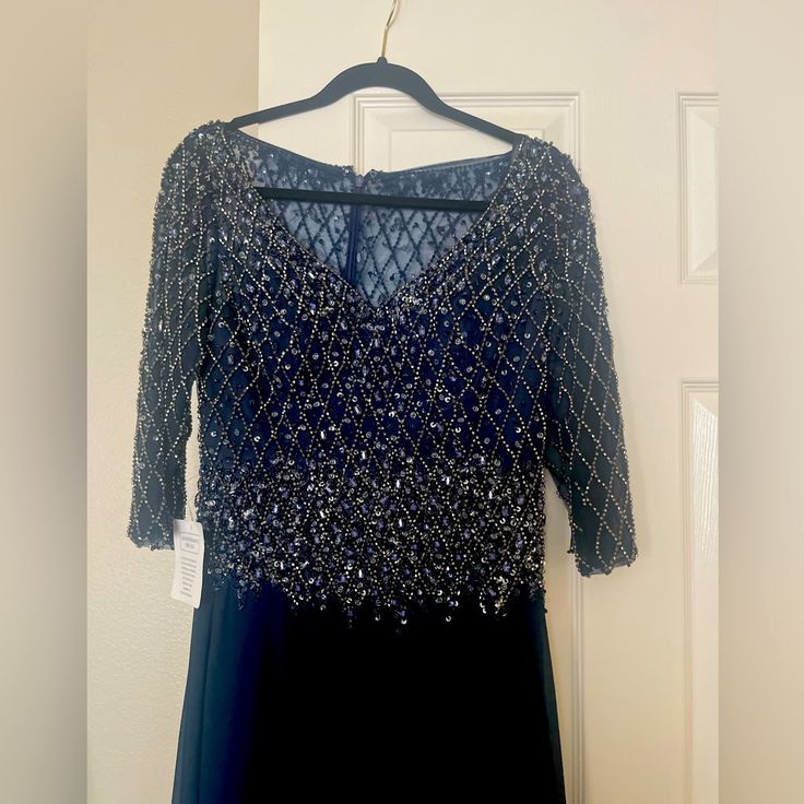 Gorgeous Navy Dress That Can Be Worn At Formal Gatherings Or Weddings. Long With Long Sleeves, Embellished With Sequin On Top. Very Elegant And Feminine. Embellished Gala Evening Dress For Mother Of The Bride, Mother Of The Bride Sequin Evening Dress, Elegant Blue Mother Of The Bride Dress For Gala, Blue Embellished Evening Dress, Blue Embellished Floor-length Mother Of The Bride Dress, Fitted Dress For Mother Of The Bride, Evening Event, Fitted Dress For Mother Of The Bride Evening Occasion, Fitted Dress For Mother Of The Bride Evening, Embellished Long Sleeve Dress For Mother Of The Bride