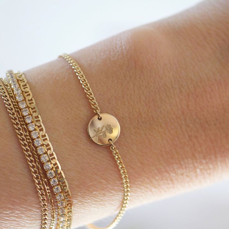 Our Birthflower Disc Bracelet features a tiny engraved disc with the birthflower of your choice hanging along a sturdy curb chain. Finished with a spring ring clasp and extender, making it easy to wear and adjust for the perfect fit.DETAILS- 14kt gold filled or sterling silver- 6" long with a 2" extender- Can be worn 6-8 inches- Choose one birthflower for engraving January: CarnationFebruary: VioletMarch: Cherry BlossomApril: DaisyMay: LilyJune: RoseJuly: LotusAugust: PoppySeptember: AsterOctobe Dainty Adjustable Curb Chain Bracelet, Adjustable Round Curb Chain Jewelry, Adjustable Curb Chain Jewelry, Dainty Engraved Charm Bracelet, Dainty Adjustable Engraved Chain Bracelet, Dainty Engraved Adjustable Chain Bracelet, Adjustable Engraved Dainty Chain Bracelet, Round Curb Chain Bracelet Gift, Adjustable Everyday Round Disc Jewelry