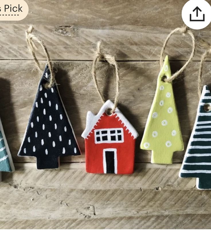 christmas ornaments are hanging on a wooden board with twine ties and polka dot designs