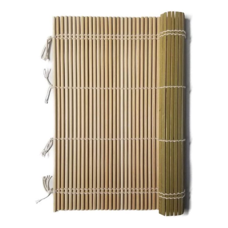 a bamboo mat with white string attached to the top and bottom, against a white background