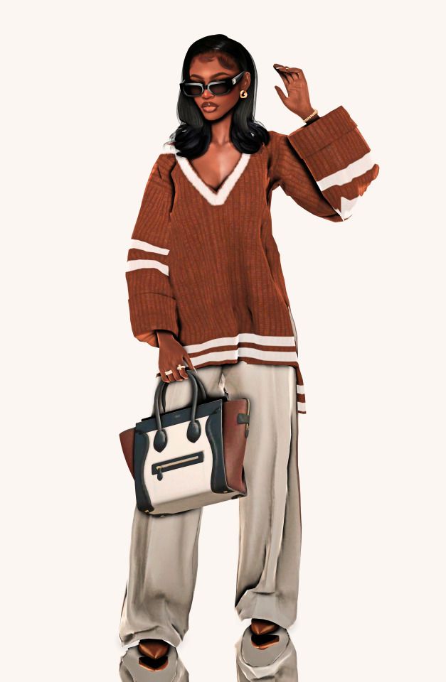 a woman in brown sweater and white pants holding a handbag with her right hand