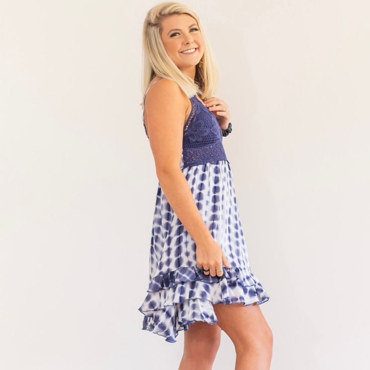 The perfect boho tie dye dress has arrived and we are loving this way too much! Smocked bandeau back with adjustable elastic straps add for comfort and custom length adjustment. Double shoulder straps and removable bra pads added for support. Don't forget the scalloped edges and "x" strap back detail for the perfect aesthetics. When we say this dress is comfortable and gorgeous, we mean it! Imported. Jessica is wearing a size Small Bohemian Smocked Dress With Ruffled Straps, Summer Beach Smocked Dress With Spaghetti Straps, Summer Smocked Dress With Spaghetti Straps For Beach, Smocked Dress With Spaghetti Straps For Beach, Beach Smocked Dress With Ruffles And Spaghetti Straps, Beach Smocked Dress With Spaghetti Straps, Casual Beach Smocked Dress With Spaghetti Straps, Casual Smocked Beach Dress With Spaghetti Straps, Beach Smocked Dress With Spaghetti Straps And Ruffles