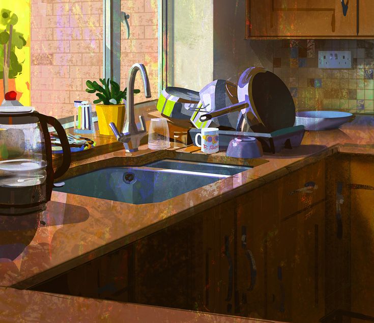 a kitchen counter with pots and pans on it next to a sink in front of a window