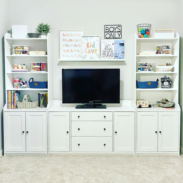 the entertainment center is clean and ready to be used as a playroom for children