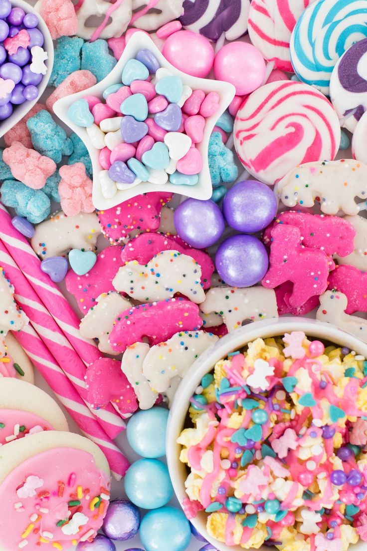 colorful candies and sweets are scattered on the table