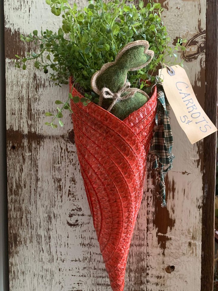 a potted plant is hanging on the side of a door