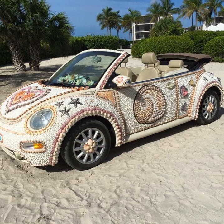 the car is decorated with shells and seashells