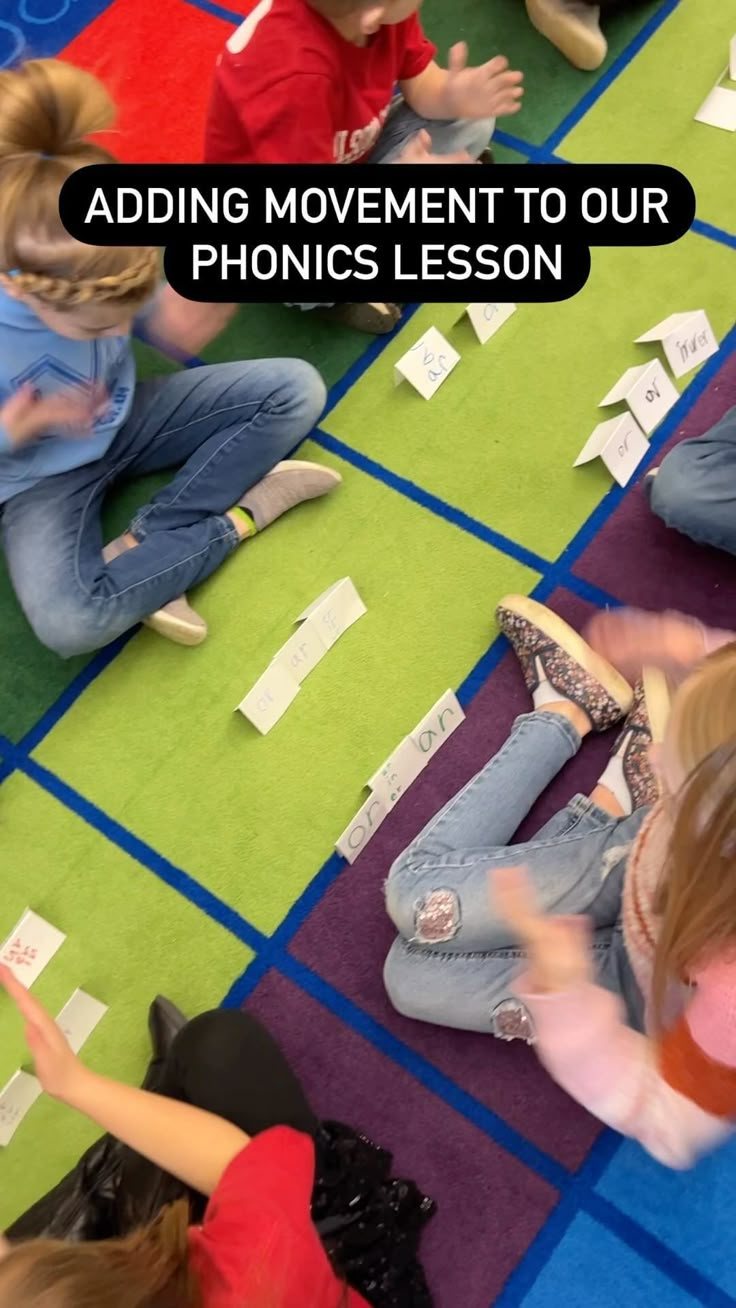 children sitting on the floor with their hands in the air, reading and doing different things