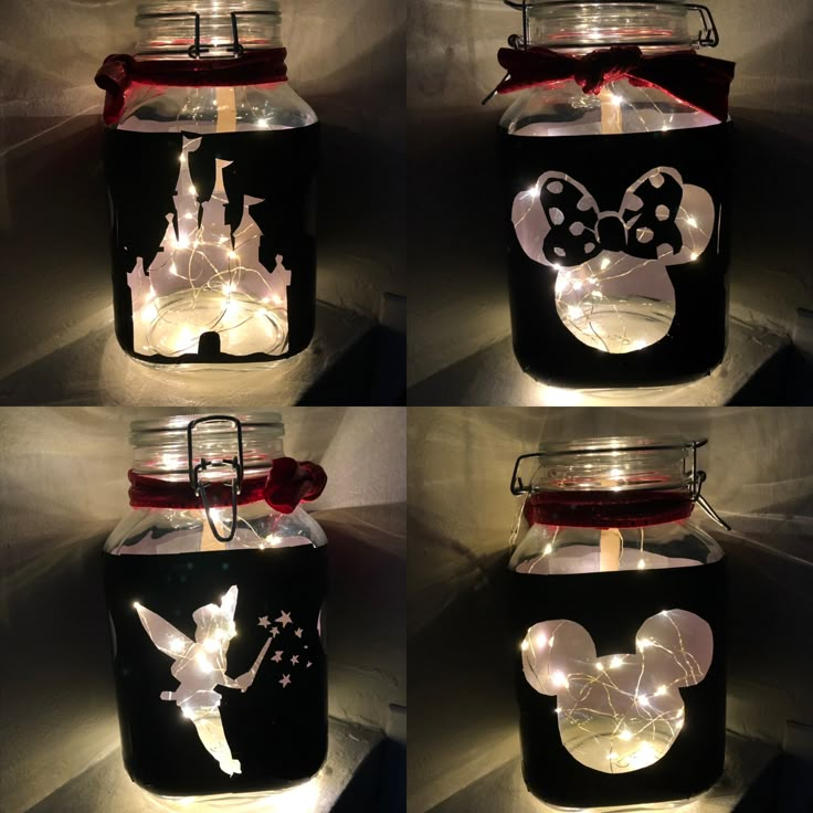 four jars with lights in them are decorated to look like mickey mouse and minnie mouse