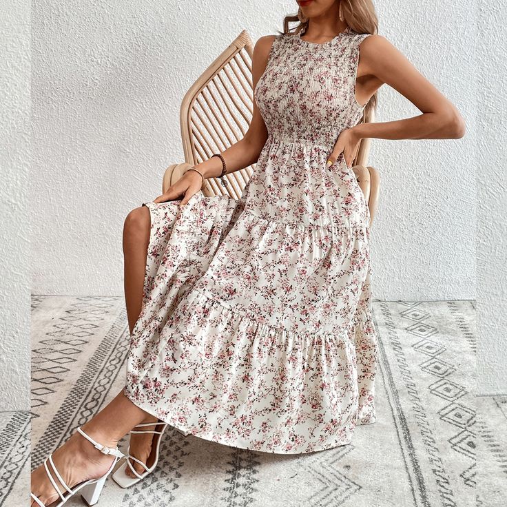 Experience elegance in our Spring/Summer Floral Swing Dress, a stunning addition to your holiday wardrobe. This dress features a captivating floral pattern and a large swing silhouette, perfect for embracing the beauty of the season.Crafted with care, this dress offers both comfort and style. The floral design adds a touch of sophistication, while the large swing creates a flowy and graceful look. Whether you're attending a holiday party, a summer wedding, or simply enjoying a day out, this dress effortlessly combines elegance and comfort.The lightweight fabric is ideal for warmer weather, ensuring you stay cool and chic. Pair this Floral Swing Dress with your favorite sandals or heels to complete a stylish ensemble. The versatile design makes it suitable for various occasions, allowing yo Floral Print A-line Sundress For Garden Party, Spring Vacation A-line Floral Dress, Feminine A-line Floral Dress For Vacation, Flowy A-line Summer Sundress, Flowy A-line Floral Dress For Vacation, Vacation A-line Sundress Midi Dress, Summer A-line Floral Dress For Garden Party, Feminine Floral Print Boho Dress For Garden Party, Floral Print A-line Midi Dress For Vacation