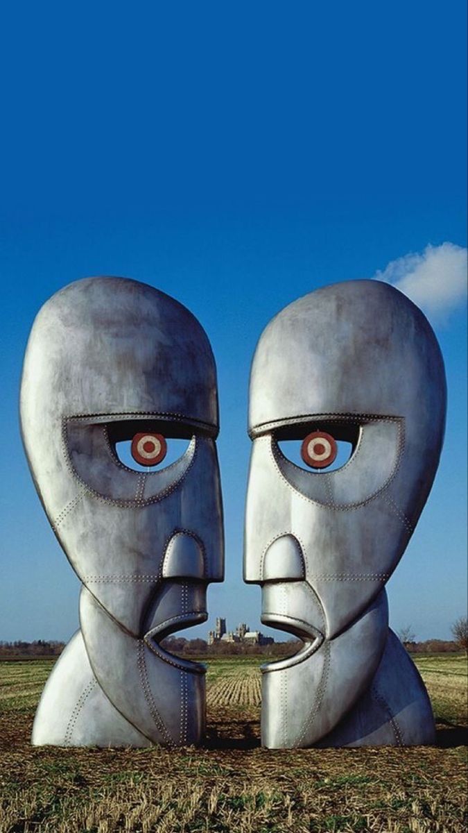 an image of two faces in the middle of a field