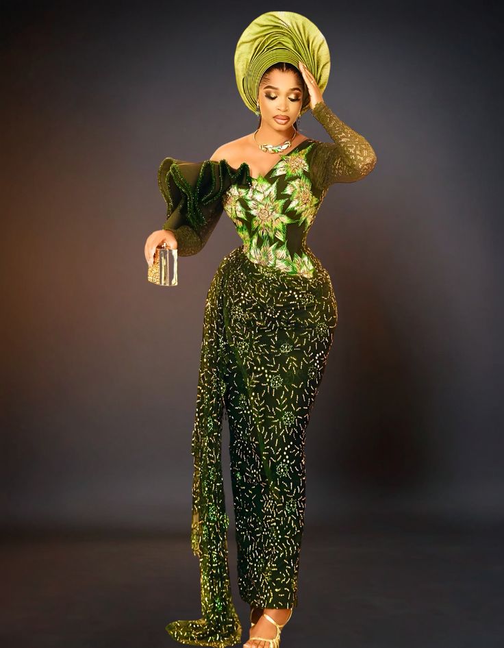 Indulge in opulence with our luxury traditional George wedding dress. Crafted with exquisite attention to detail, this dress embodies elegance and sophistication, perfect for your special day. Elevate your bridal ensemble with the timeless allure of our dark green dress. Key Features: Exquisite Design: Stand out in the crowd with our intricately designed dress, featuring traditional African motifs and embellishments. Premium Quality: Made with the finest fabrics and expert craftsmanship, our dress offers superior quality and durability for your special day. Versatile Style: Perfect for Nigerian weddings, Igbo weddings, Delta weddings, or as a wedding guest, this dress is a versatile addition to any wardrobe. Flattering Fit: Designed to accentuate your curves and flatter your figure, our dr Luxury Green Gown For Banquet, Fitted Dark Green Wedding Dress, Fitted Dark Green Dress For Wedding, Elegant Dark Green Wedding Dress, Form-fitting Dark Green Dress For Wedding, Elegant Green Gown For Banquet, Elegant Fitted Dark Green Gown, Glamorous Green Gown For Banquet, Fitted Dark Green Gown For Gala