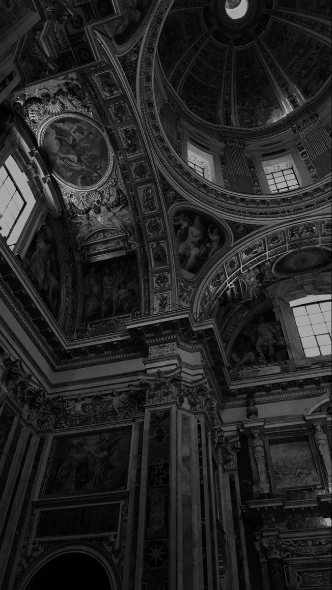 black and white photograph of the ceiling in a building with many paintings on it's walls