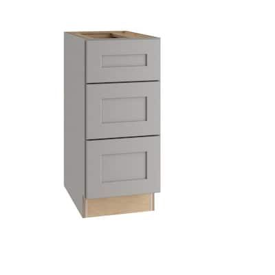 a white cabinet with two drawers on the bottom and one drawer in the middle, against a white background