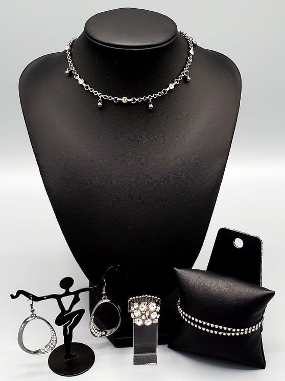 This edgy gunmetal custom choker set comes with a necklace and complimentary earrings, upgraded earrings, a clasp bracelet, and a ring with a stretchy back. Necklace - "What A Stunner": Featuring sleek fittings, dainty white rhinestones link with sections of glistening gunmetal chain around the neck. Shiny gunmetal beads dangle from the chain for a flirtatious finish. Features an adjustable clasp closure. Includes one pair of matching earrings. Upgraded earrings - "Fiercely Flauntable": Rows of Adjustable Silver Body Jewelry Choker, Adjustable Gunmetal Edgy Jewelry, Edgy Gunmetal Jewelry With Adjustable Fit, Edgy Gunmetal Jewelry, Gunmetal Dangle Earrings Metal Jewelry, Gunmetal Dangle Jewelry, Gunmetal Dangle Earrings, Trendy Black Sterling Silver Jewelry, Adjustable Gunmetal Necklaces For Party