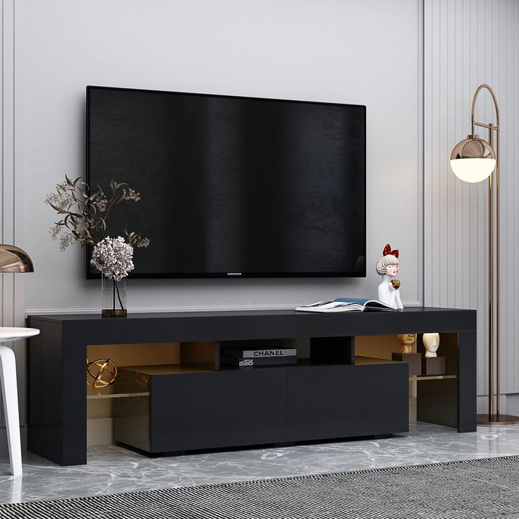 a large flat screen tv mounted to the side of a wall in a living room