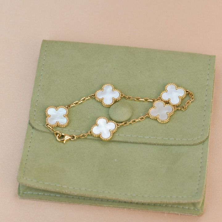 This elegant CLOVER BRACELET features 5 beautiful motifs made from Mother of Pearl. With its unique design and high quality materials, it adds a touch of sophistication and charm to any outfit. Perfect for any occasion, it makes a thoughtful and stylish gift. ADDITIONAL INFORMATION Color: Gold Stone: Mother of pearl Ref. H121312B Material:- 925 Sterling Silver - 18k Gold Plated- 18k Real Gold ( contact us via instagram) Bracelet wrist size: 19 cm Our replica products are committed to quality and Elegant Hallmarked Gold Plated Bracelets, Elegant White Bracelet Perfect For Gift, Elegant White Bracelet For Gift, Luxury Polished Chain Bracelet Gift, Luxury Polished Chain Bracelet As Gift, Luxury Gold-plated Silver Chain Bracelet, Luxury Gold Plated Silver Chain Bracelet, Luxury Sterling Silver Chain Bracelet As Gift, Luxury White Gold Chain Bracelet Tarnish Resistant