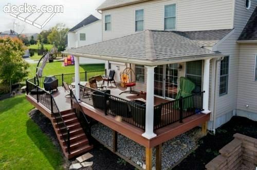 a house with a deck and stairs leading up to it