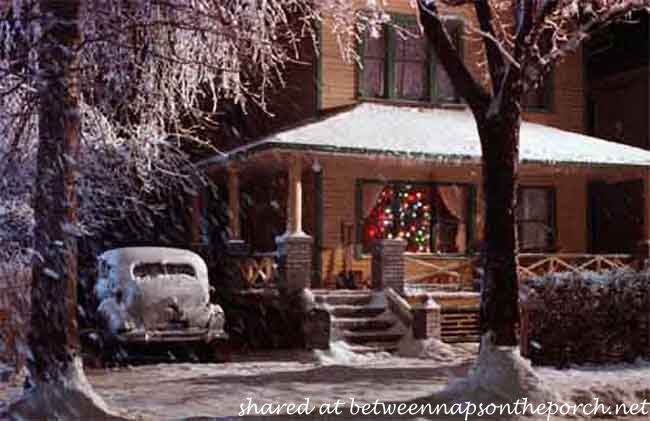 an old car parked in front of a house with snow on the ground and trees