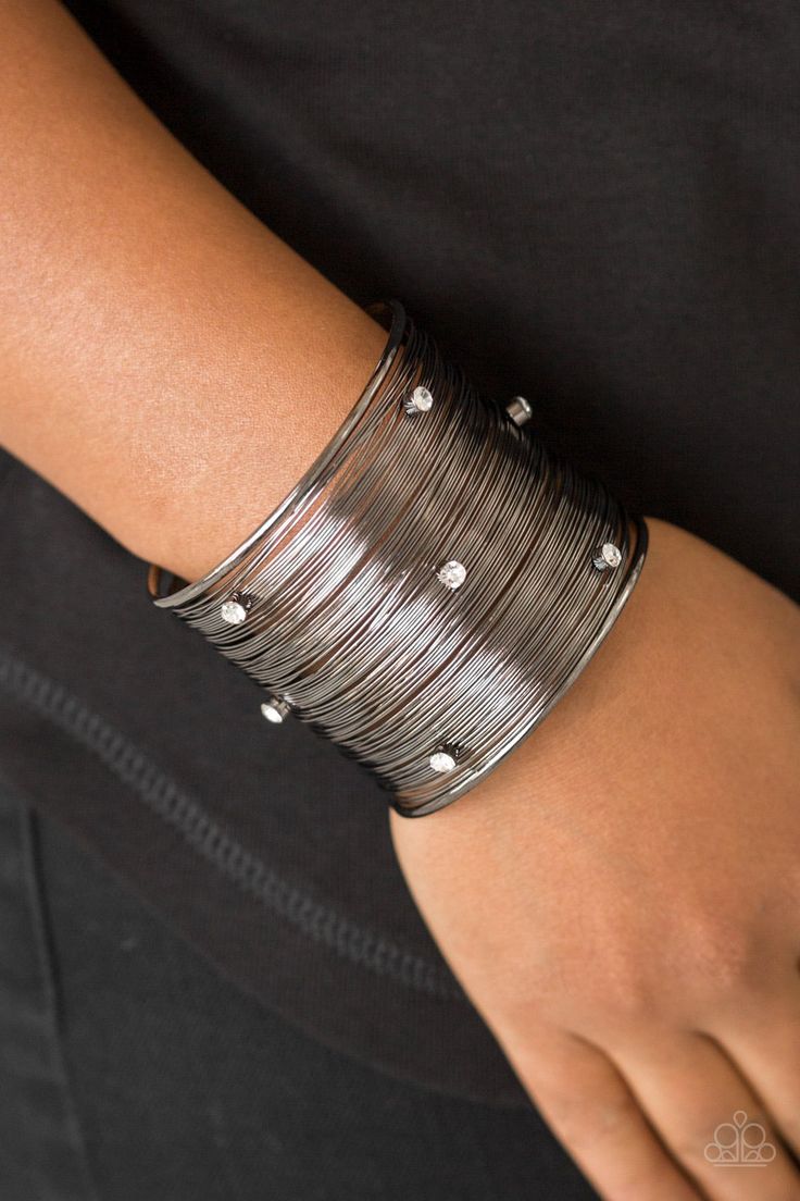 Shimmery gunmetal wires wrap back and forth along a gunmetal frame, creating a bold cuff. Glassy white rhinestones are sprinkled across the dramatic cuff for a glamorous finish. Sold as one individual bracelet. Black Cuff Bracelet, Wire Cuff, Black Bracelet, Black Bracelets, Paparazzi Accessories, White Rhinestone, Affordable Jewelry, Paparazzi Jewelry, Gorgeous Jewelry