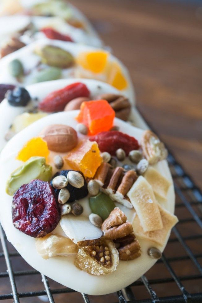 a white plate topped with lots of different types of food on top of a metal rack